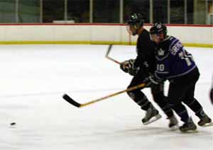 Brewster going for the puck