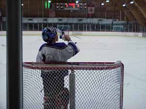 Goaltender Marty Hoesli taking a break during a rough game